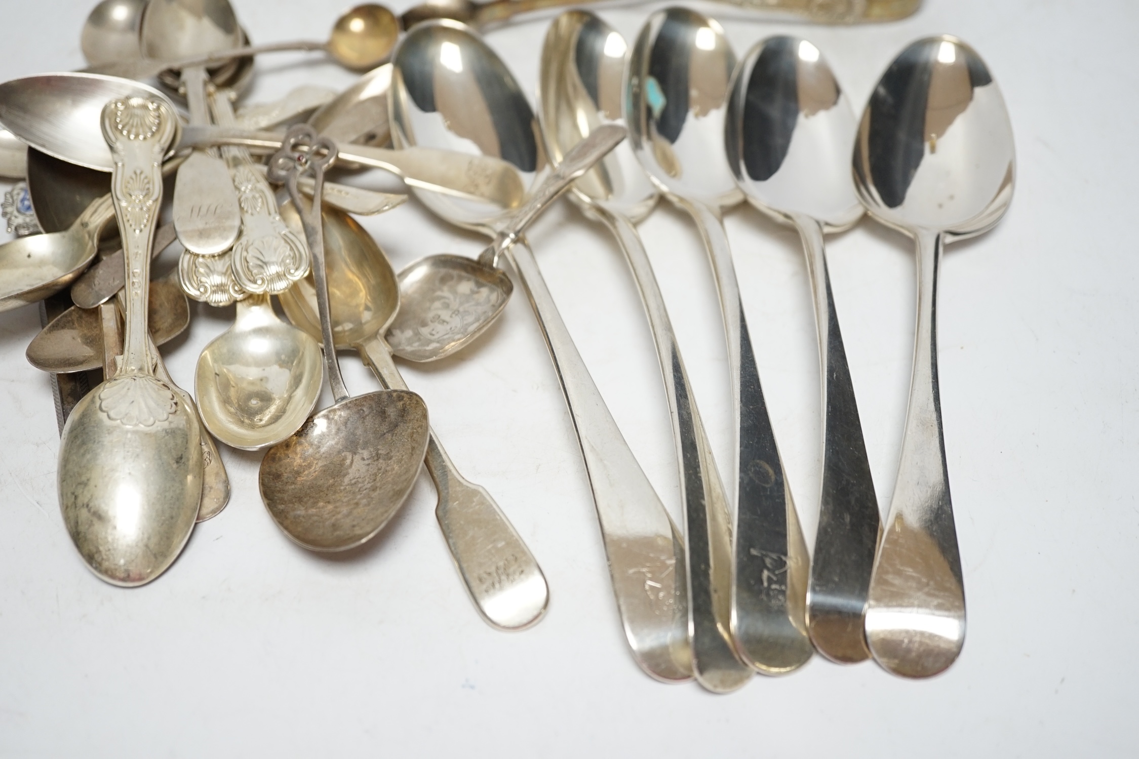 A small quantity of assorted silver flatware including a pair of George III silver Old English pattern table spoons by Elizabeth Tookey, London, 1767 and a set of three similar table spoons by Eley & Fearn, London, 1808,